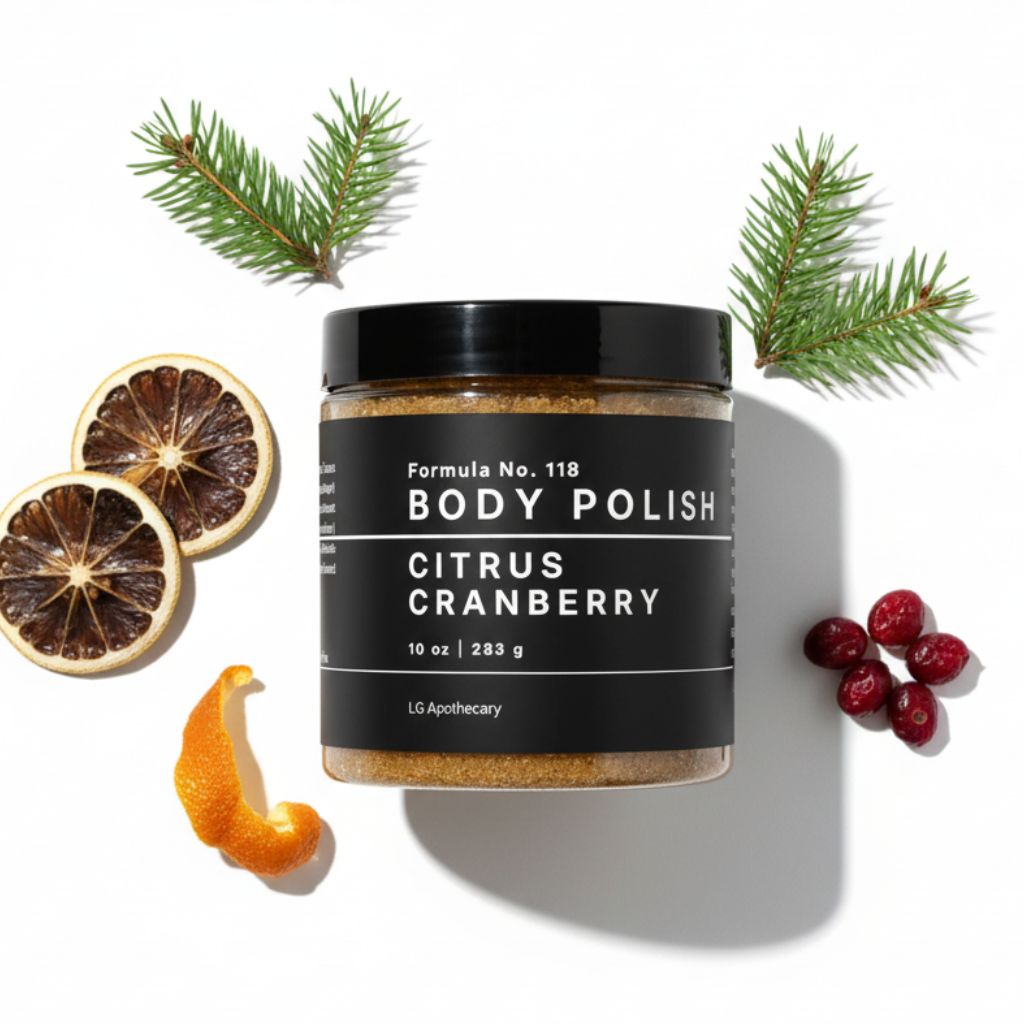 Jar of Formula No. 118 Citrus Cranberry Body Polish on a white background, styled with dried citrus slices, fresh cranberries, an orange peel, and pine sprigs.