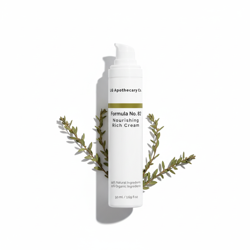 Skincare cream bottle with green leaves on a white background