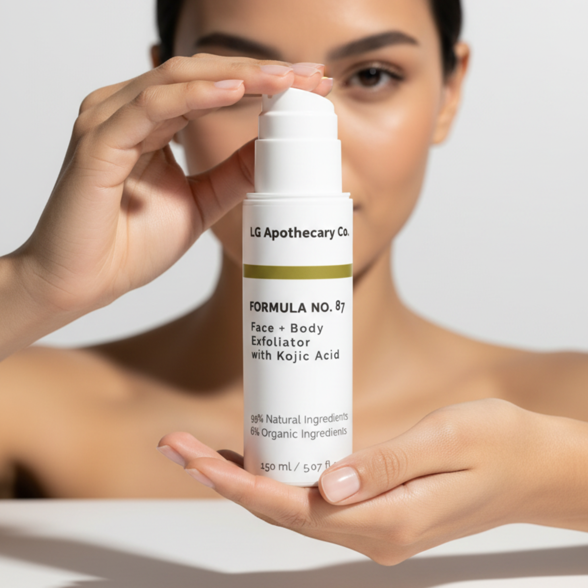 Person holding a skincare product labeled 'LG Apothecary' against a neutral background