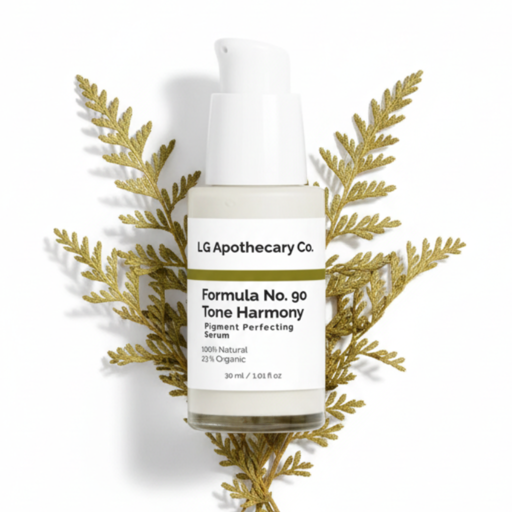 Skincare bottle labeled 'LG Apothecary Co' with decorative gold leaves on a white background