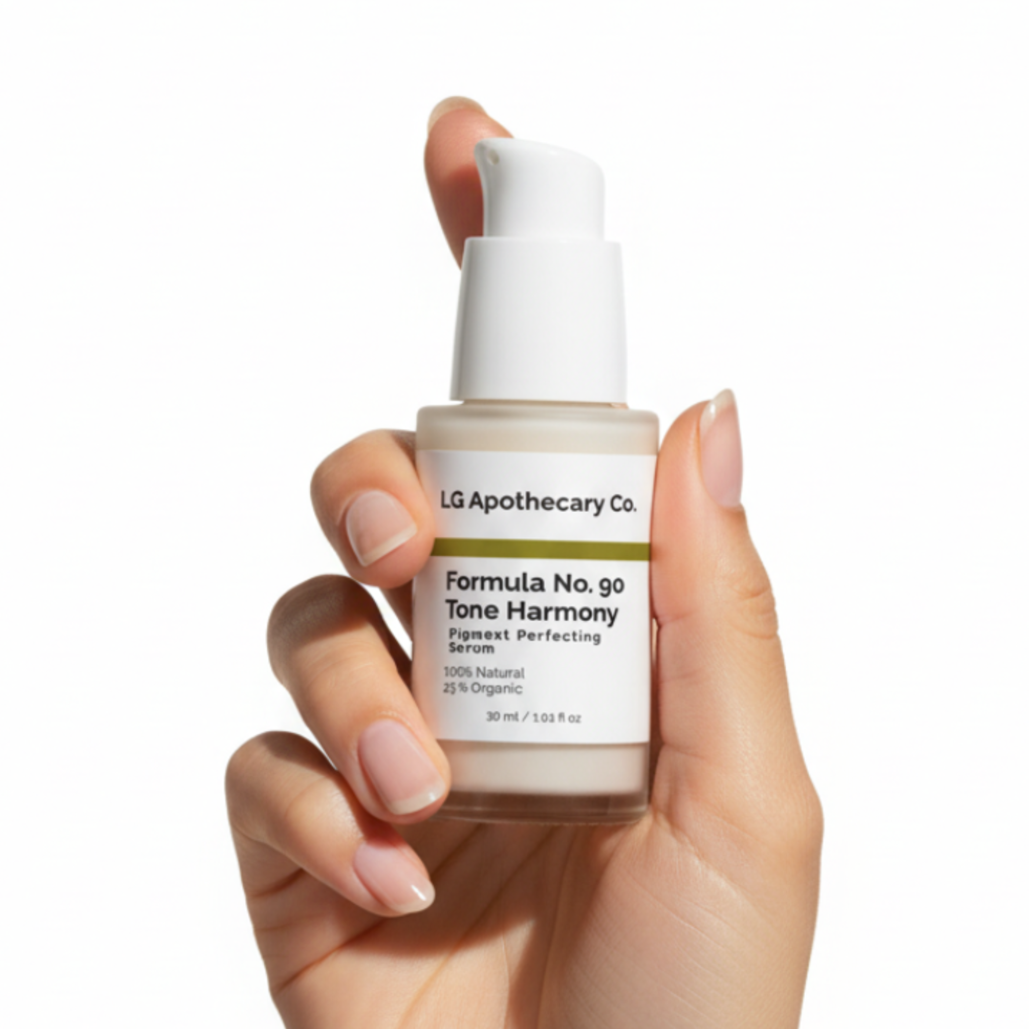 Hand holding a bottle of LA Apothecary Tone Harmony serum against a white background