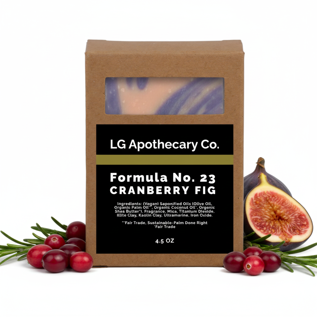 LG Apothecary Co. soap bar in a brown box with cranberries and figs around it.